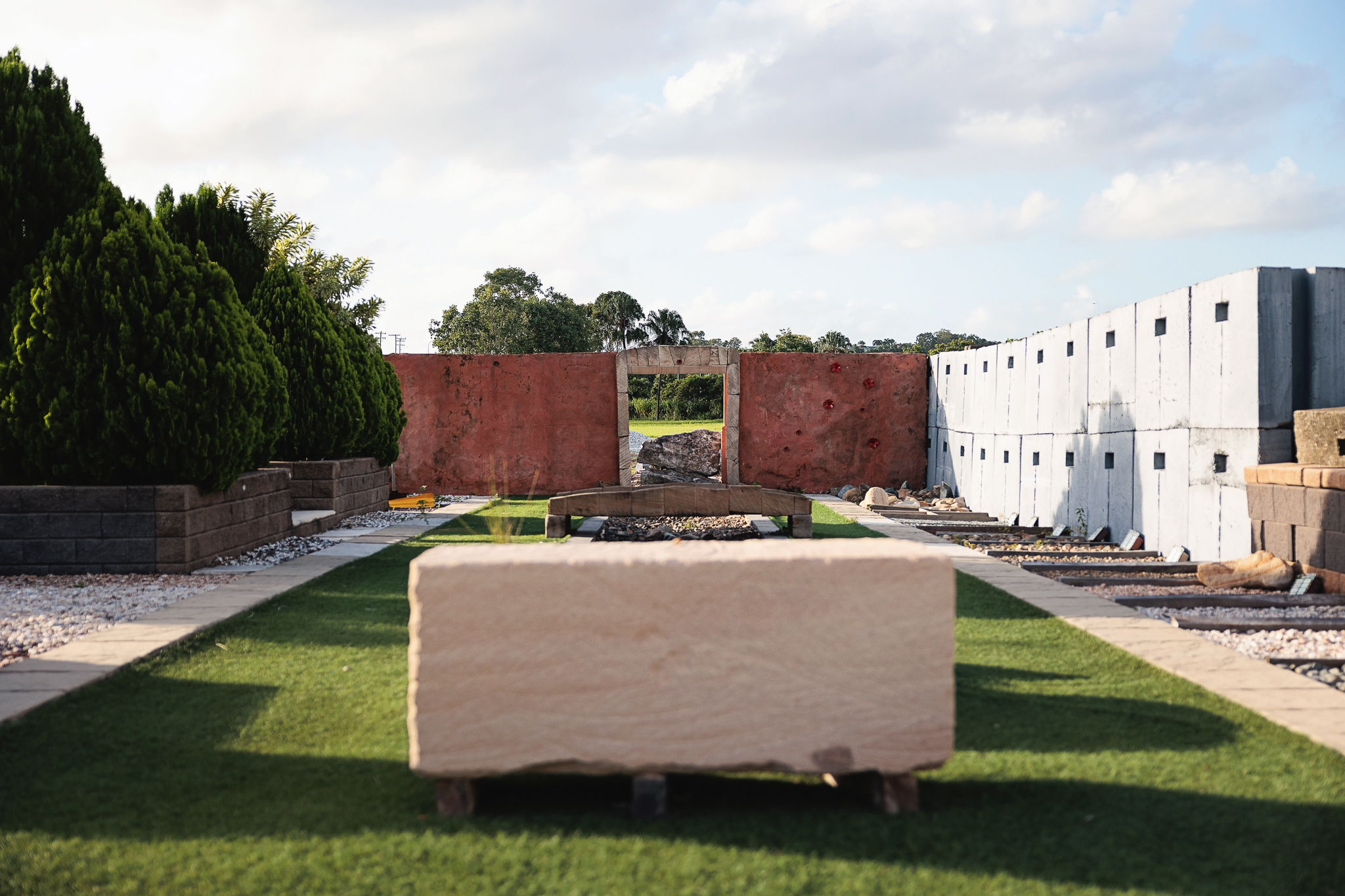 Sandstone retaining wall – Natural stone blocks with warm earthy tones, used for durable and visually appealing landscaping structures